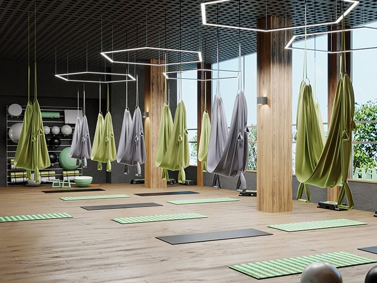 Moderne Yoga- und Entspannungsräume mit Hängematten und Matten.